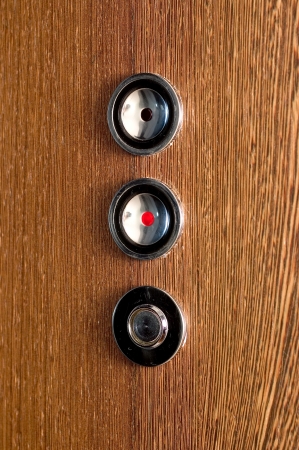 three buttons in a luxury elevator