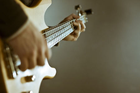 guitar in the hands old style fashioned photo