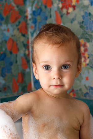 Happy baby in bathroom foamの写真素材