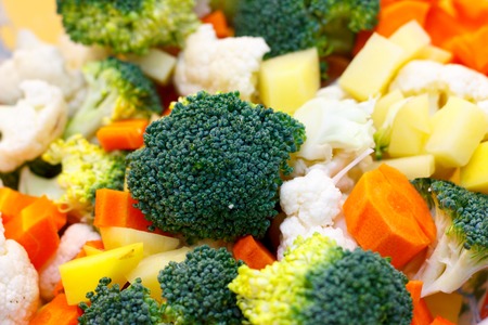 Fresh vegetables are basis of Healthy food. Bright carrots, broccoli, cauliflower, cabbage are ingredients for cooking vegetables and a vegetarian diet. Soft focus.の写真素材