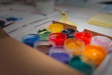 colored paint gouache in a box. Concept home education.
