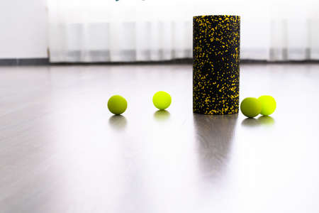 Light green Myofascial release massage balls, roll and other body roll recover on gray matの写真素材