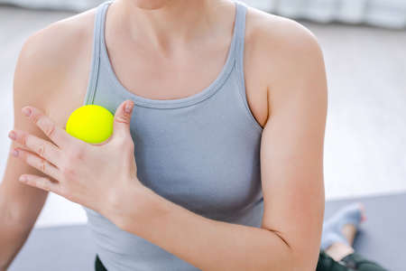 Close up Woman use Myofascial release massage balls on shoulderの写真素材
