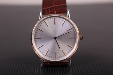 wristwatch with leather bracelet on a dark backgroundの写真素材