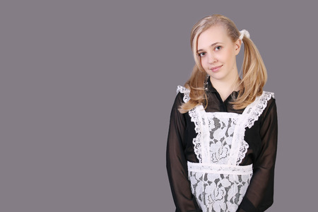 Schoolgirl senior classes  studio shot on dark backgroundの写真素材