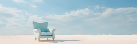 Blue armchair on the white sand dunes in the desert.の素材