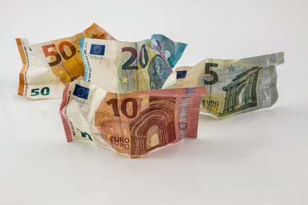 Euro banknotes and white backgroundの写真素材