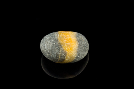 Colorful stone with different designs and colors and black backgroundの写真素材