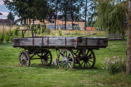 Old wooden wagon for horses or cattle to transport thingsの写真素材