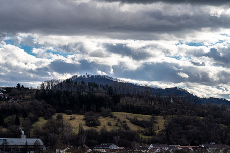 Little village in the middle of the countryside with church on the hillの写真素材