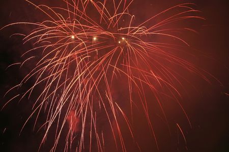 Fireworks blowing in the sky at nightの写真素材