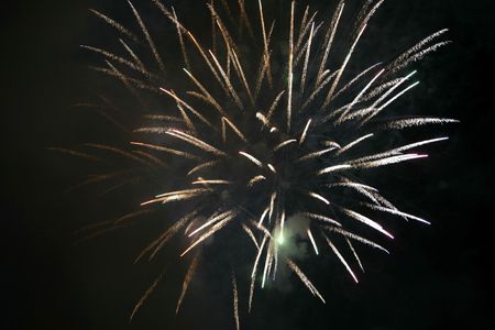 Fireworks blowing in the sky at nightの写真素材