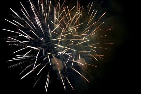 Fireworks blowing in the sky at nightの写真素材