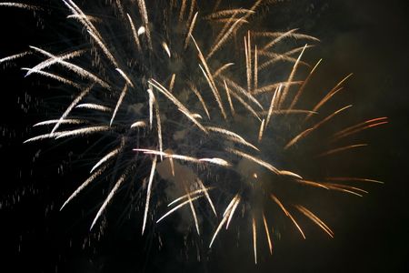 Fireworks blowing in the sky at nightの写真素材