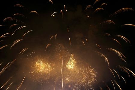 Fireworks blowing in the sky at nightの写真素材