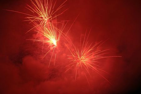 Fireworks blowing in the sky at nightの写真素材