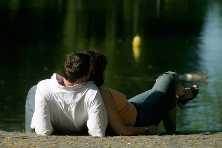 a couple relaxing at the waterの写真素材