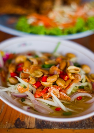 thai sause for fired fish, with nut, chilli, mango, and fish sauseの写真素材