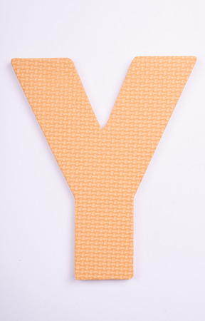 alphabet Y made from foam on white isolatedの写真素材