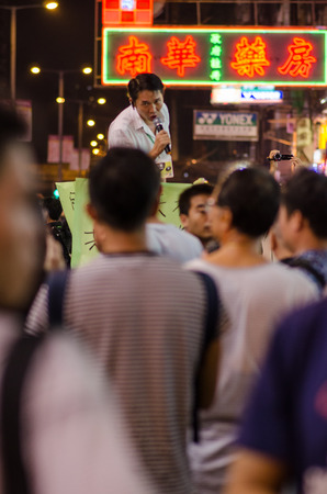 HONG KONG, OCT 15: protesters stand listening to speech in Mongkok on 15 October 2014.People protest for urban development  and mainland china policy to hong kong. more people join the protestのeditorial素材