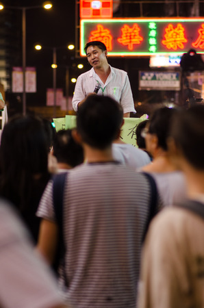HONG KONG, OCT 15: protesters stand listening to speech in Mongkok on 15 October 2014.People protest for urban development  and mainland china policy to hong kong. more people join the protestのeditorial素材