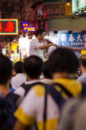 HONG KONG, OCT 15: protesters stand listening to speech in Mongkok on 15 October 2014.People protest for urban development  and mainland china policy to hong kong. more people join the protestのeditorial素材