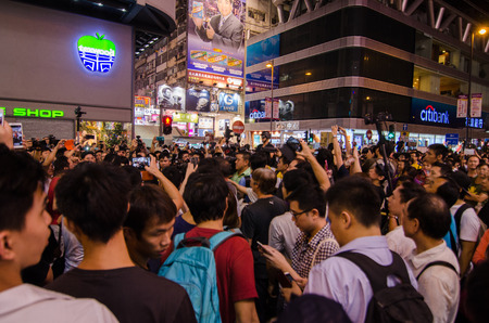 HONG KONG, OCT 15: protesters stand listening to speech in Mongkok on 15 October 2014.People protest for urban development  and mainland china policy to hong kong. more people join the protestのeditorial素材