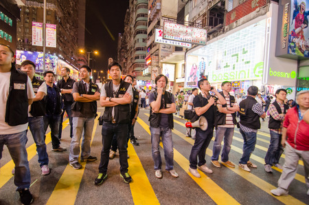 HONG KONG, OCT 16: Hongkong police bewara a many protesters in Mong Kok on 16 October 2014. during Umbrella revolution, they will control protest do not make illegal.のeditorial素材