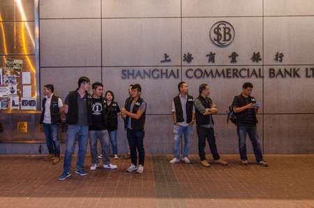 HONG KONG, OCT 16: Hongkong police bewara a many protesters in Mong Kok on 16 October 2014. during Umbrella revolution, they will control protest do not make illegal.のeditorial素材