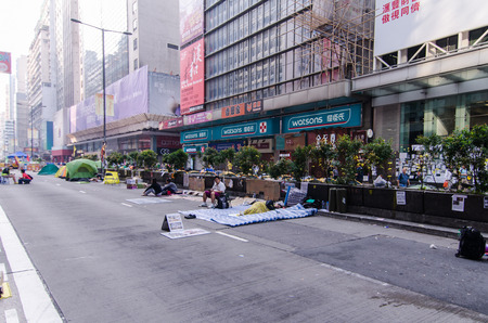 HONG KONG, OCT 16: young protesters sleep on the nathan road in Mong Kok on 16 October 2014. they rest in the morning after protest during all night.のeditorial素材
