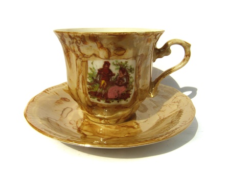 Brown cup and saucer for tea in classic style isolated on white background                               の写真素材