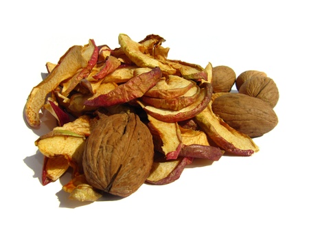 Dried apples and nuts close up isolated on white background                               の写真素材