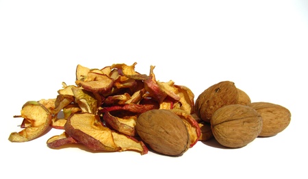 Dried apples and nuts, healthy breakfast, isolated on a white background                              の写真素材