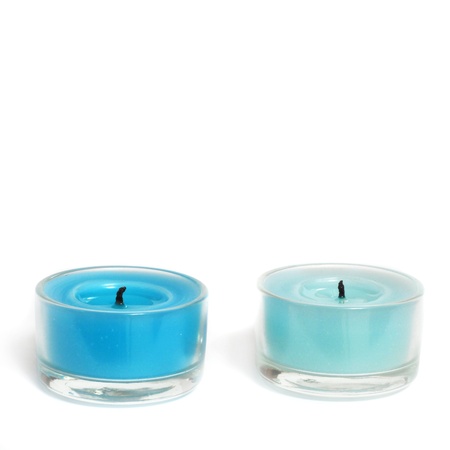Two blue Candles blow out isolated on white backgroundの写真素材