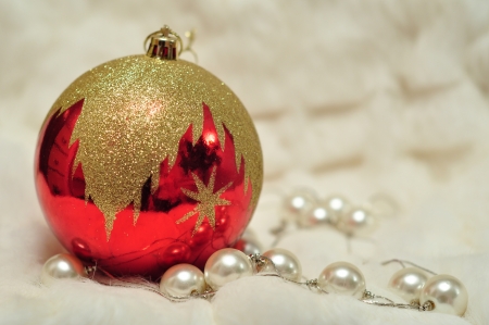 Christmas decoration: red bead, pearls on white blured backgroundの写真素材