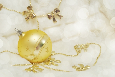 Golden Christmas decorations on blurred background with space for textの写真素材