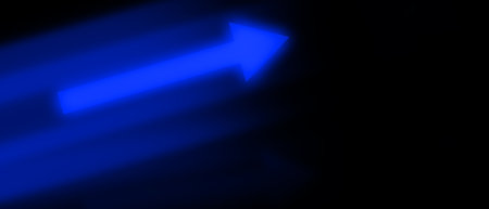 blue light arrows and speed lines on black backgroundの写真素材