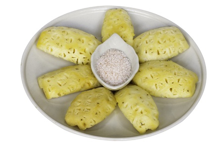 Pineapple slice to piecese with mixed salt,sugar and chilliの写真素材