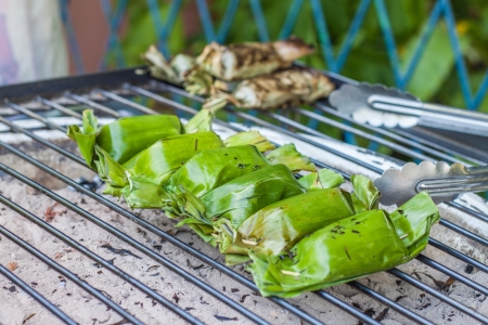 The roasted sticky rice with coconut milk and taro wrapped by banana leafの写真素材