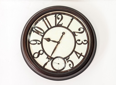 Vintage clock on the white wall