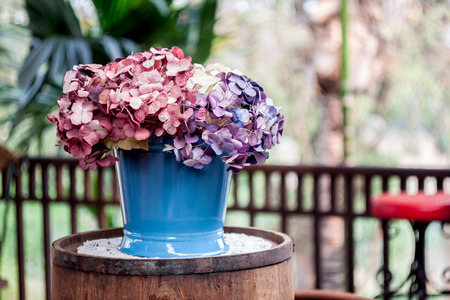 Paper flower in flower pot with bokeh backgroundの写真素材