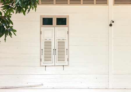 White wooden window of vintage house in Bangkok,Thailandの写真素材