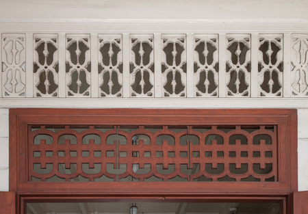 Vintage carving wood and wall for decoration and ventilation in houseの写真素材