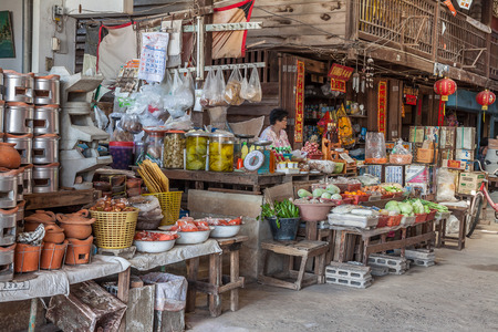 Supanburi, THailand -May 24,2014: GoaHong Market ,hundred years old market,  along river with wooden house conserved for villager and traveller buy goods and learn old lifestyleのeditorial素材