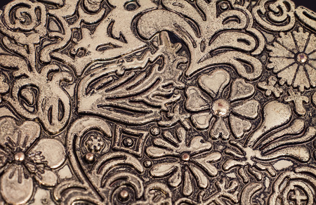 Close up floral pattern on brass plateの写真素材