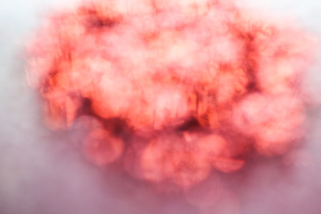 Blur abstract of red background reflect from shiny objectの写真素材