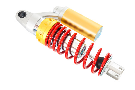 New red motorcycle suspension isolated on white backgroundの写真素材