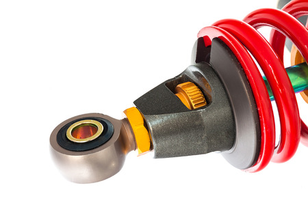 New red motorcycle suspension isolated on white backgroundの写真素材