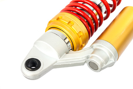 New red motorcycle suspension isolated on white backgroundの写真素材