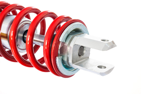 New red motorcycle suspension isolated on white backgroundの写真素材